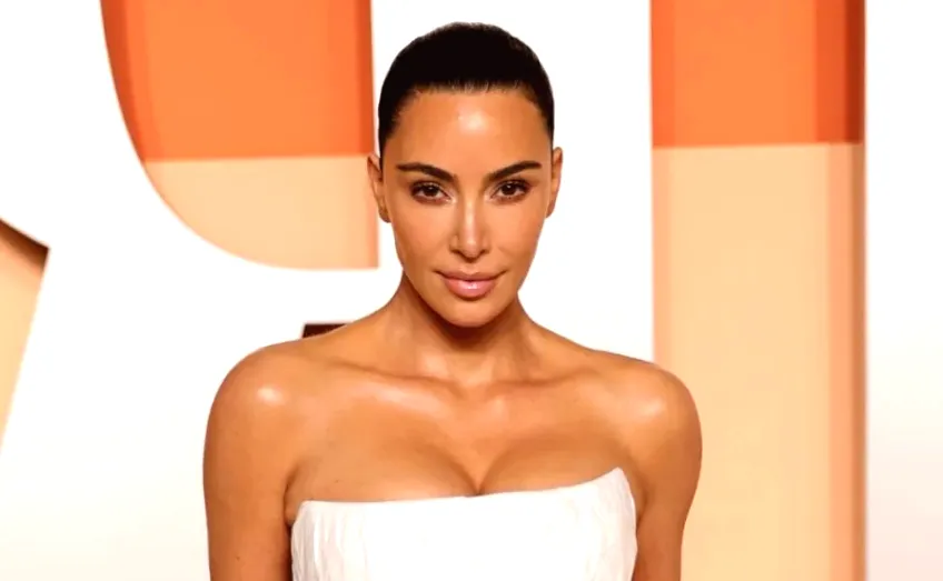 Kim Kardashian heats up in a backless, body-hugging onesie