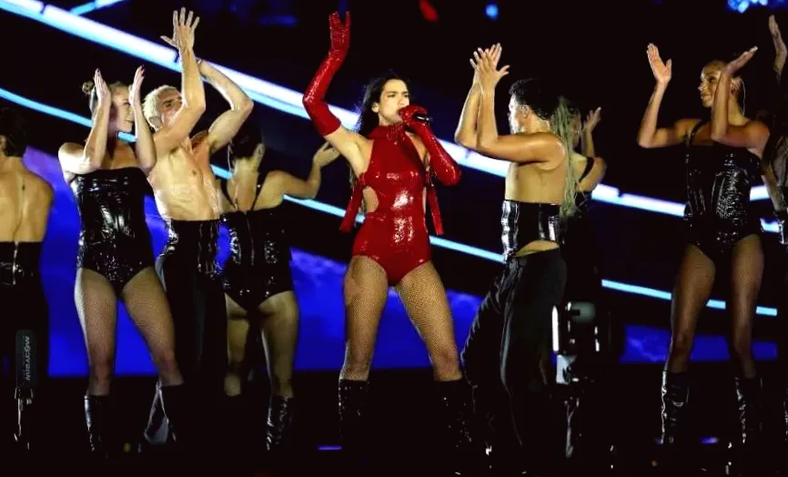 Dua Lipa's Red Bodysuit Secured by Just Two Belts