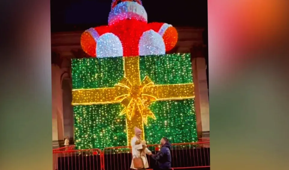 Couple's holiday proposal with 'Mr Zippy' Santa becomes internet sensation