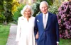 Queen wears 'happiness restored' brooch in yearly Christmas card