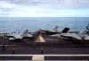 A US aircraft carrier's sudden maneuver to dodge enemy fire caught sailors off guard and caused a jet with faulty brakes to crash into the sea