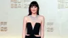 Dakota Johnson Wears Valentino Gown with High Slit and Cutouts