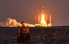 Pelicans gaze at the sky as rocket launches in Photo of the Week