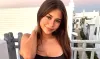 OnlyFans’ Sophie Rain Stuns in Mini Black Dress Masterpiece