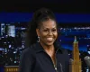 Michelle Obama stuns in bold patterned blazer paired with daring leggings and thigh-high boots
